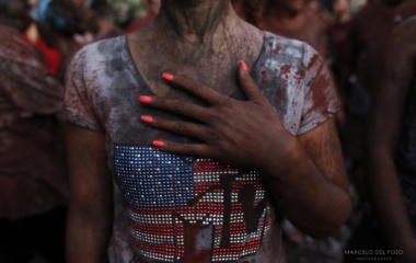 A reveller covered in paint takes part during the annual Cascamorras festival in Guadix, southern Spain