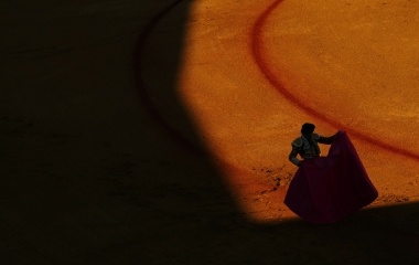 Spanish bullfighter Antonio Barrera prepares to perform a pass to a bull in Seville