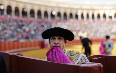 Spanish matador Julian Lopez "El Juli" bites his capote during a bullfight in Seville, southern Spain