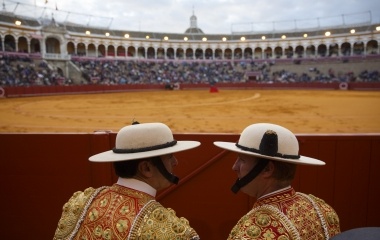 Spanish picadores chat during a bullfight at The Maestranza bullring in the Andalusian capital of Seville