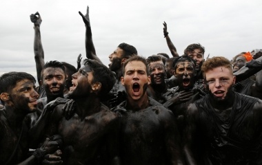 Revellers covered in grease take part in the annual Cascamorras festival in Baza, southern Spain