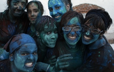 Revellers covered in paint pose for a picture in the annual "Cascamorras" festival in Guadix