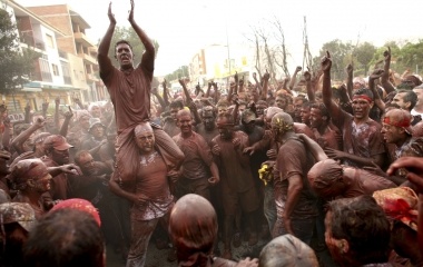Revellers covered in paint take part during the annual 'Cascamorras' festival in Guadix, southern Spain