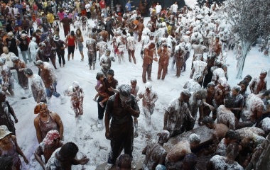 Revellers covered in paint take part in the annual "Cascamorras" festival in Guadix