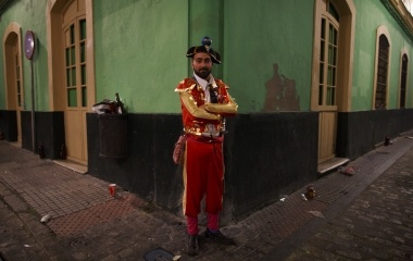 Jose Pereira, 29, reveller in a bullfighter fancy costume poses for a portrait during the Carnival of Cadiz, southern Spain