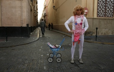 Man dressed up as a baby stands during the Carnival in Cadiz