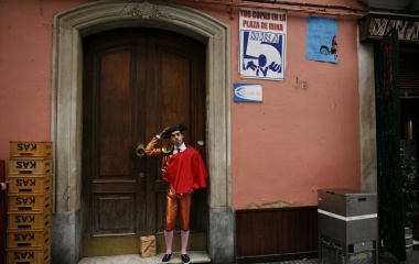 A man dressed up as a bullfighter touches his hat during the Carnival in Cadiz