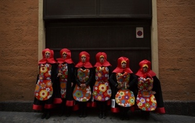 Women called "Las Mariuskas" pose in fancy costumes during the Carnival of Cadiz