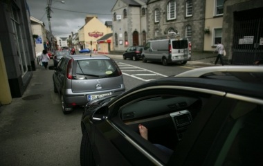 A woman sits in a car in Sligo, Ireland June 25, 2011.