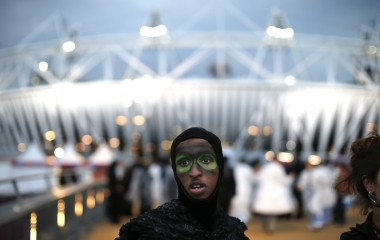 A performer is seen before the start the opening ceremony in the Olympic Stadium at the Olympic Park in London