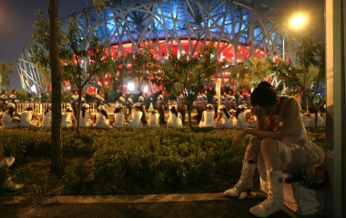 A performer waits before taking part in the last rehearsal of the opening ceremony of the Beijing 2008 Olympic Games