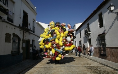 A seller holds a cluster of ballons during the annual San Antonio Abad (Saint Anton Abbott) festival in the Southern village of Trigueros near Huelva