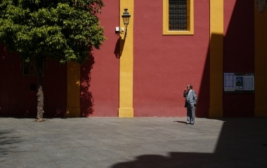 A man smokes a cigarette outside a church in the Andalusian capital of Seville March 25, 2014.