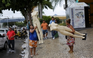 People carry mannequins outside the central market in Fortaleza
