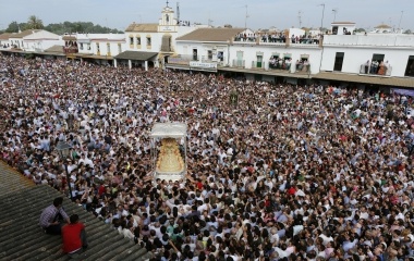 Pilgrims crowd around the Virgin of El Rocio during a procession around the shrine of El Rocio in Almonte, southern Spain