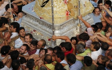 The Virgin of El Rocio is carried by pilgrims during a procession around the shrine of El Rocio in Almonte, southern Spain