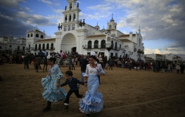 Pilgrims run next to the shrine of El Rocio in Almonte, southern Spain