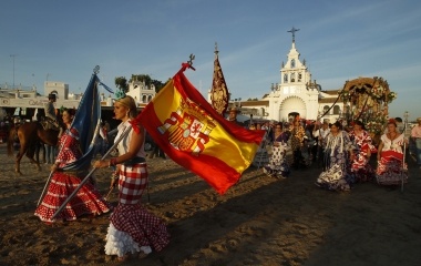 A pilgrim takes part in a procession next to the shrine of El Rocio in the province of Huelva