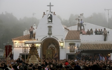 Pilgrims crowd around the Virgin of El Rocio during a procession around the shrine of El Rocio in Almonte