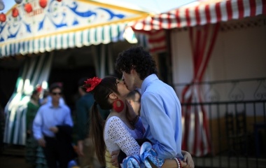 A couple kiss during a bullfight in the Andalusian capital of Seville