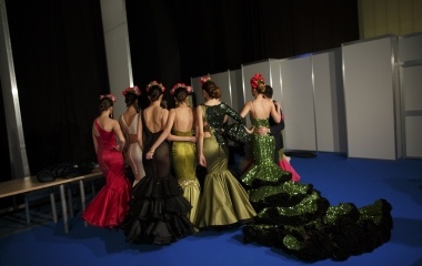 Models wearing creations by Rafael Leveque pose for a picture backstage during the International Flamenco Fashion Show SIMOF in the Andalusian capital of Seville