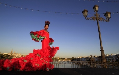 A model wearing a flamenca dress walk during a Moda de Sevilla (Sevilla fashion) show in the Andalusian capital of Seville
