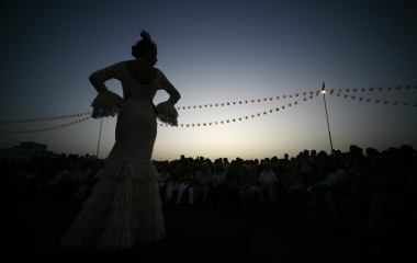 A model presents a flamenca creation from Pilar Vera during a Flamenco Fashion Show in Seville