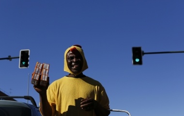 Howard Jackson, 36, a Liberian migrant offers packets of tissues to drivers in the Andalusian capital of Seville, southern Spain