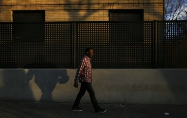 Howard Jackson, 36, a Liberian migrant walks on his way to the university in the Andalusian capital of Seville, southern Spain