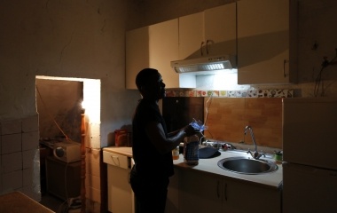 Howard Jackson, 36, a Liberian migrant prepares his breakfast at his home in the Andalusian capital of Seville, southern Spain