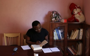 Howard Jackson, 36, a Liberian migrant studies at his home in the Andalusian capital of Seville, southern Spain