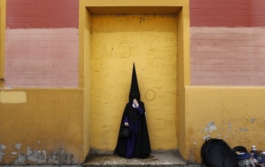 David, 6, a penitent boy of San Bernardo brotherhood poses during Holy Week in the Andalusian capital of Seville, southern Spain