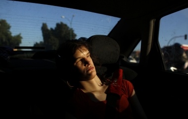 Deaf-blind Ines Garcia sits in her father's car in Seville
