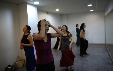 Japanese learner of flamenco song and dance, Maika Kubo, 24, sweats after finishing a flamenco class in the Andalusian capital of Seville