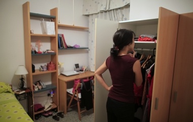 Japanese learner of flamenco song and dance, Maika Kubo, 24, looks at a wardrobe in her bedroom in the Andalusian capital of Seville