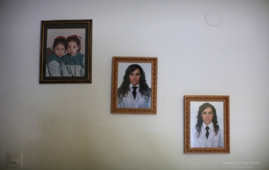 Pictures of Spanish nurses Maria Jose Marin and her twin sister Maria Teresa are displayed at the living room of their home in Paradas, southern Spain