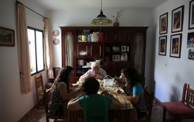 Spanish nurses Maria Jose Marin her twin sister Maria Teresa, her father Jose Manuel and mother Nati have lunch at their home in Paradas, southern Spain