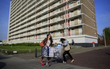 Spanish nurses Maria Teresa Marin and Sara Vallejo push a trolley with food shopping bags outside a grocery store in the Hague