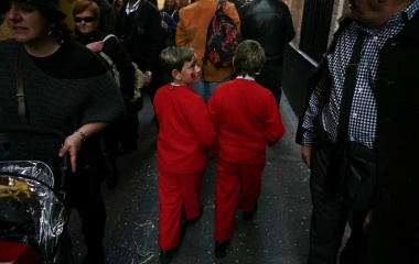 Boys in fancy costumes walk during the Carnival of Cadiz