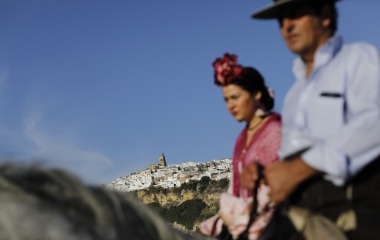 Pilgrims make their way to the shrine of Christ of Romeral as they ride past the white village of Arcos de la Frontera, southern Spain