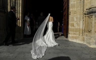 A woman walks into a church before getting married in the white village of Espera, southern Spain
