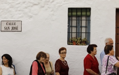People attends to watch the Virgin of los Angeles procession in the white village of Grazalema, southern Spain