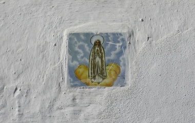 A tile with the Virgin of Fatima painted is seen at a doorway of a house in the white village of Arcos de la Frontera, southern Spain