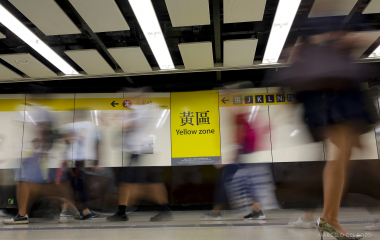 People walk in the Tsim Sha Tsui station in Hong Kong
