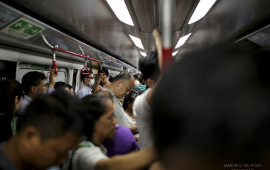 People are seen in a wagon of a Island line subway in Hong Kong