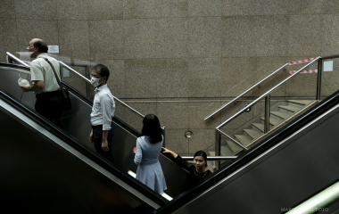 People climb escalators in the Central district in Hong Kong