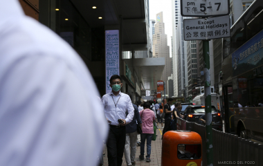 People are seen in Des Voeux road Central in the Central district in Hong Kong