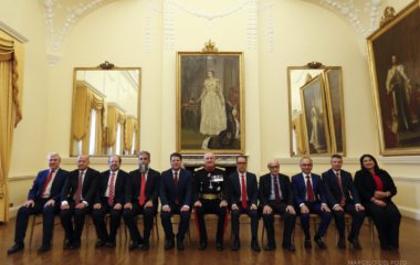 Fabian Picardo, Gibraltar's chief minister and leader of the Socialist Labour Party, sits next to the governor, Lieutenant General Edward Davis and the members of his government after winning general elections in Gibraltar