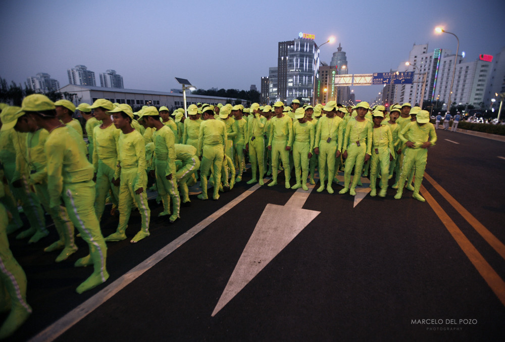 Performers wait to take part in the last rehearsal for the opening ceremony of the Beijing 2008 Olympic Games