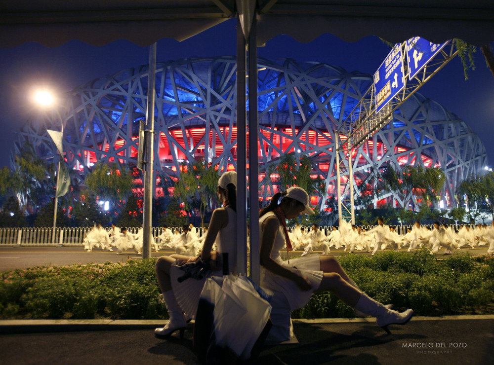 Performers wait before the last rehearsal for the opening ceremony of the Beijing 2008 Olympic Games